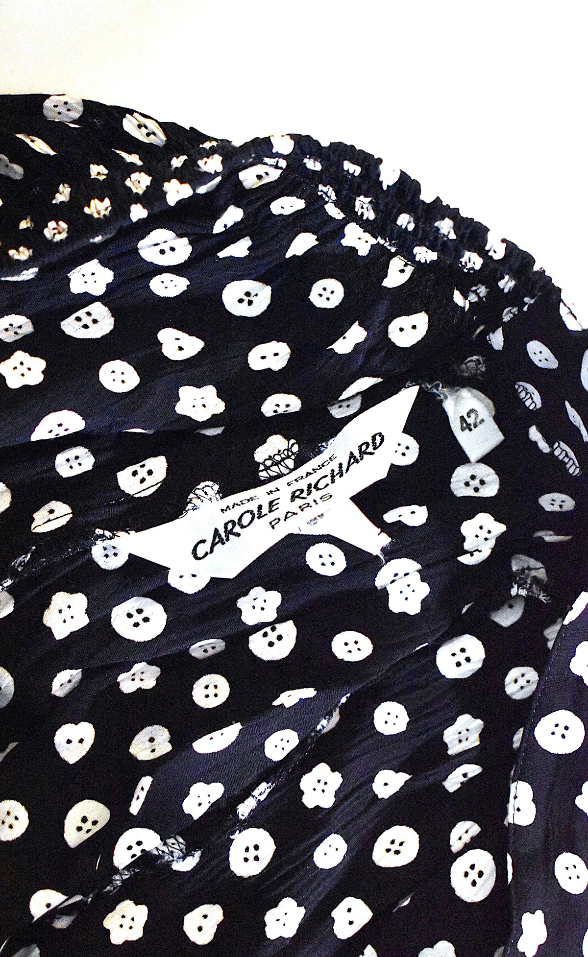 Jupe vintage noire à motif boutons blancs