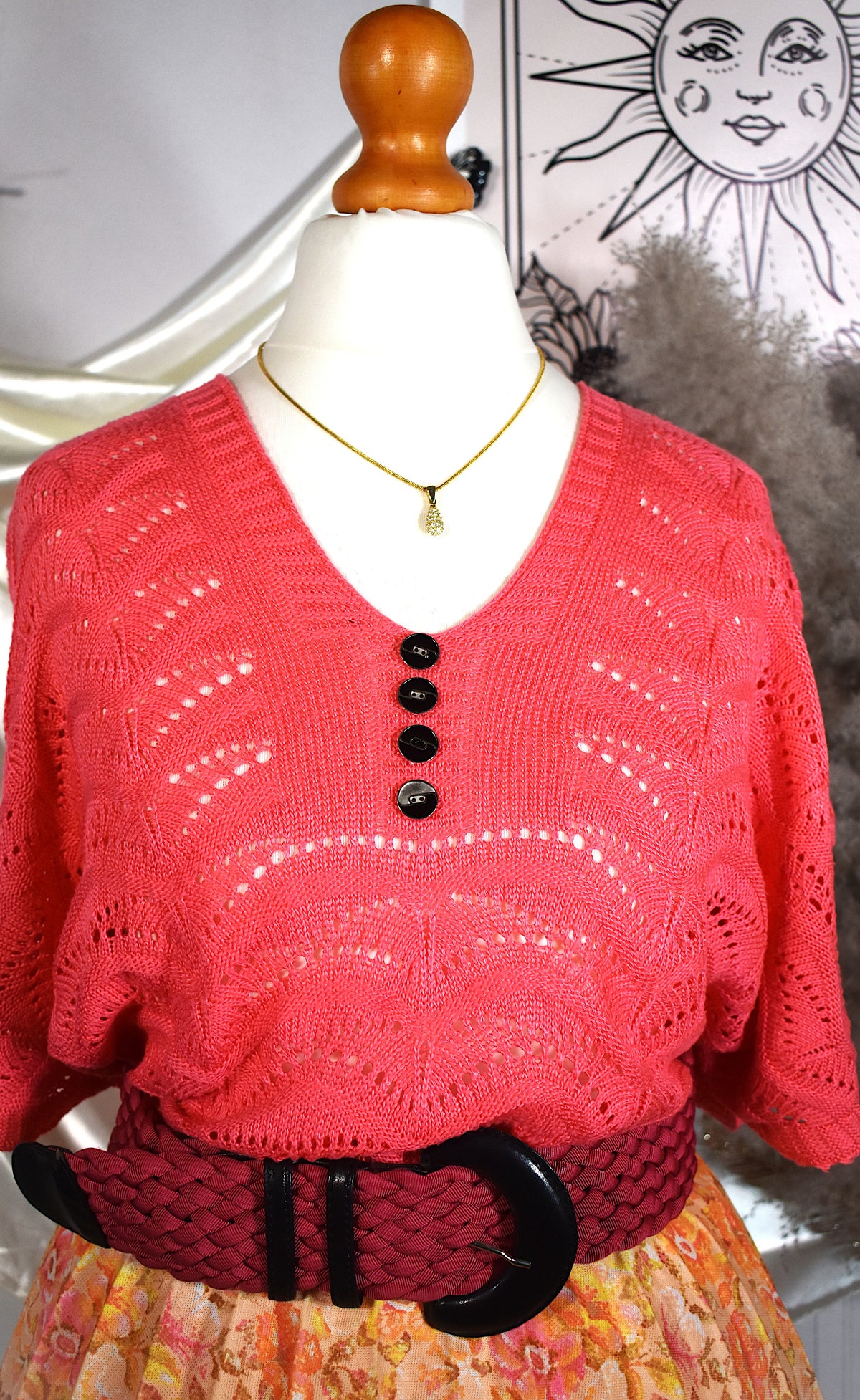 Haut rose en maille ajourée