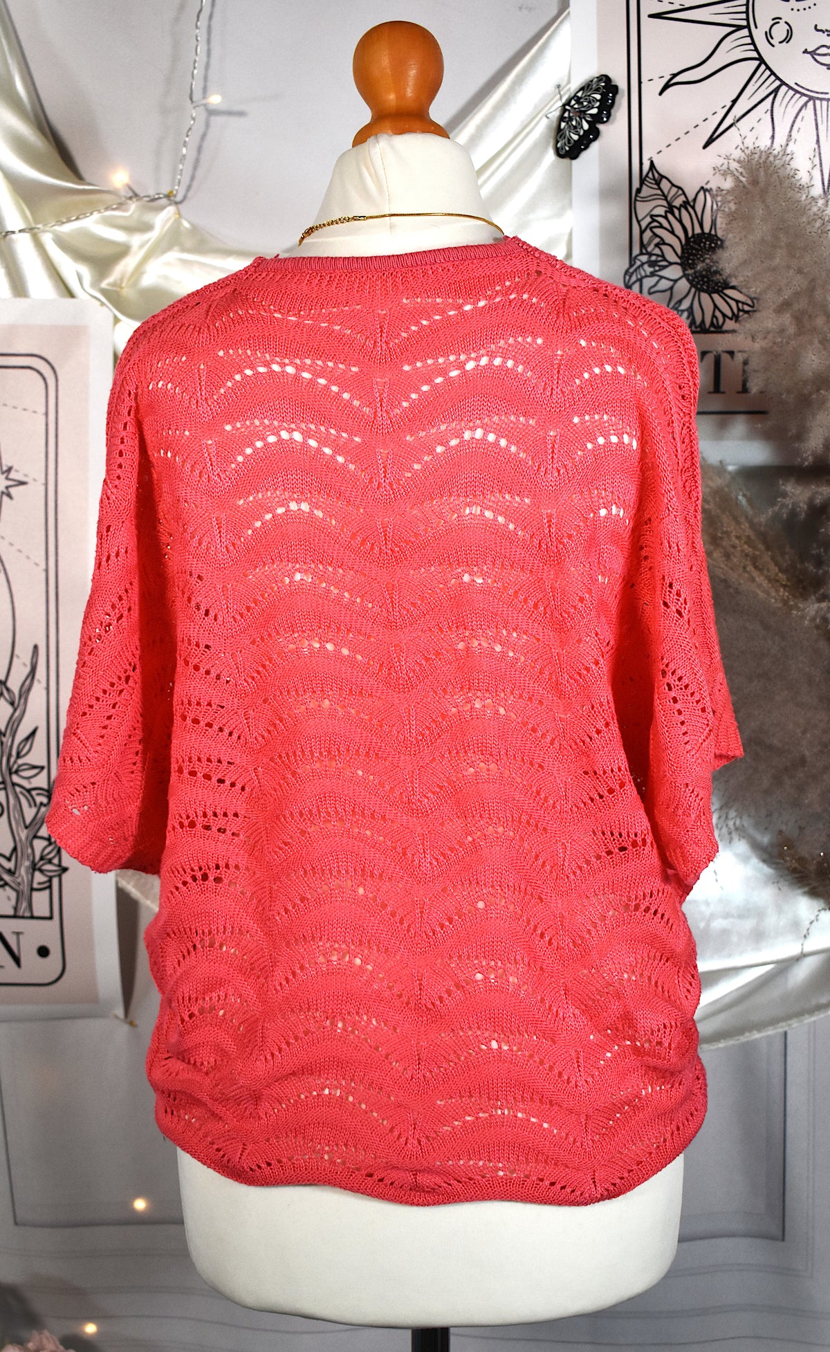 Haut rose en maille ajourée