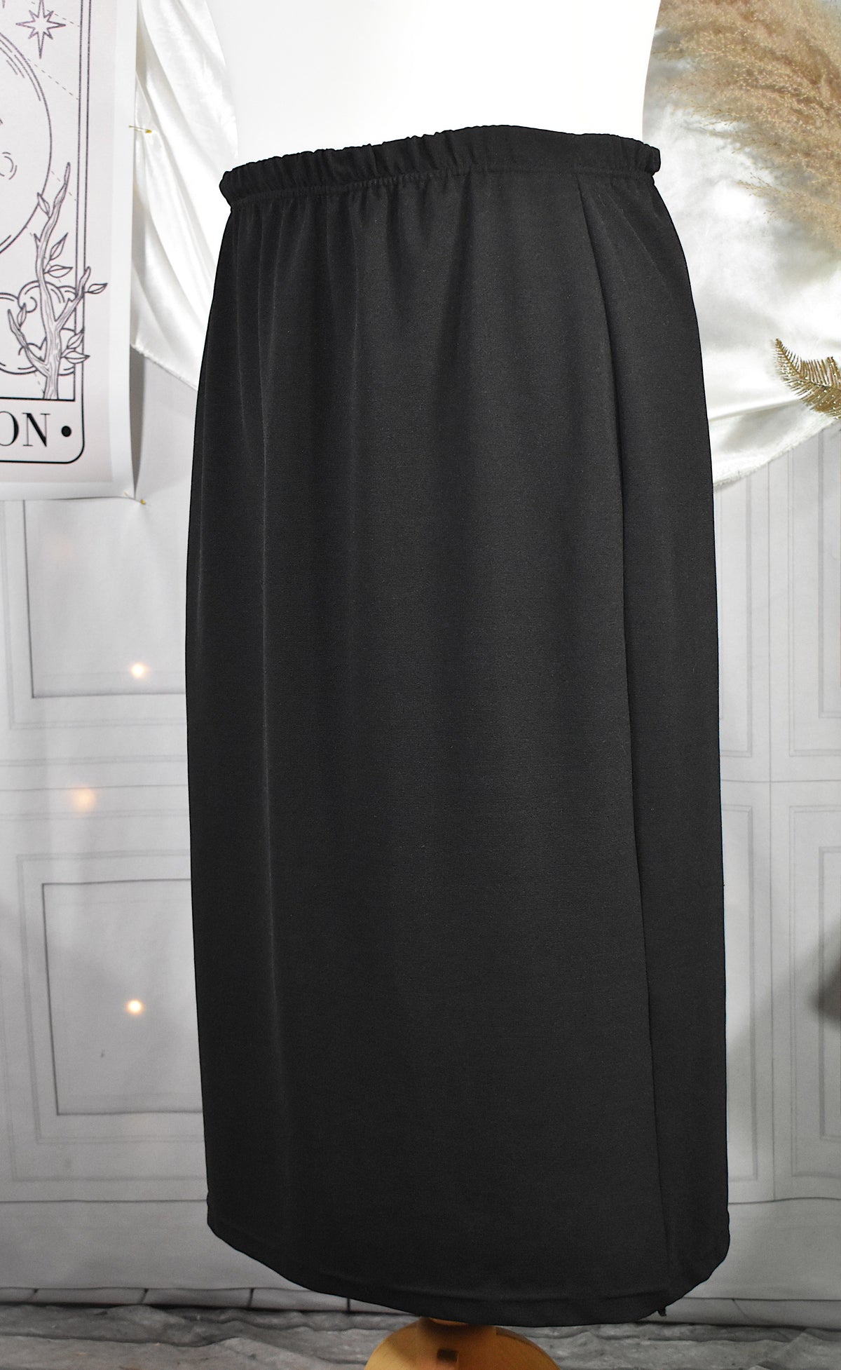 Jupe midi noire stretch coupe crayon