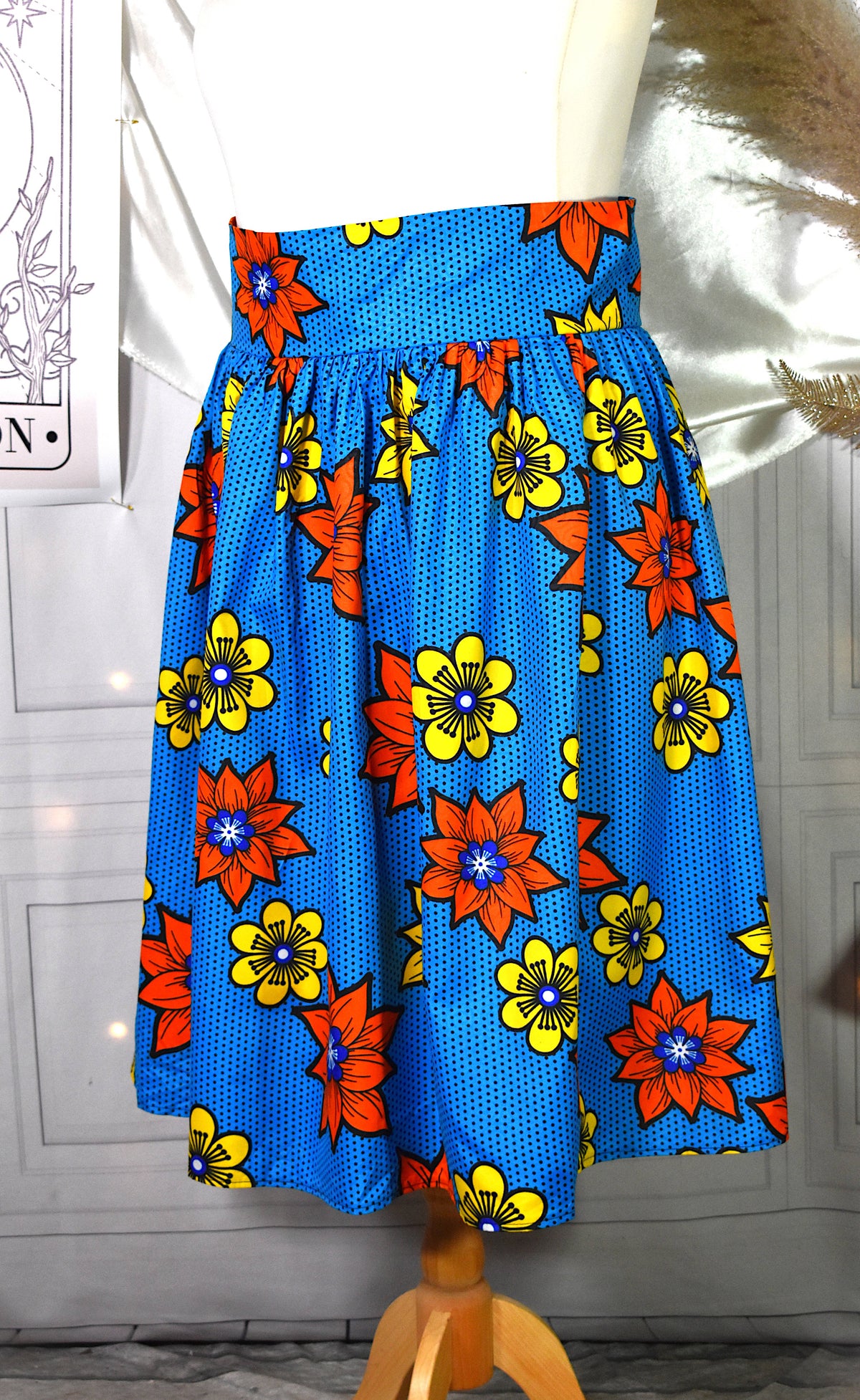Jupe midi style wax turquoise fleurs jaunes oranges avec sac