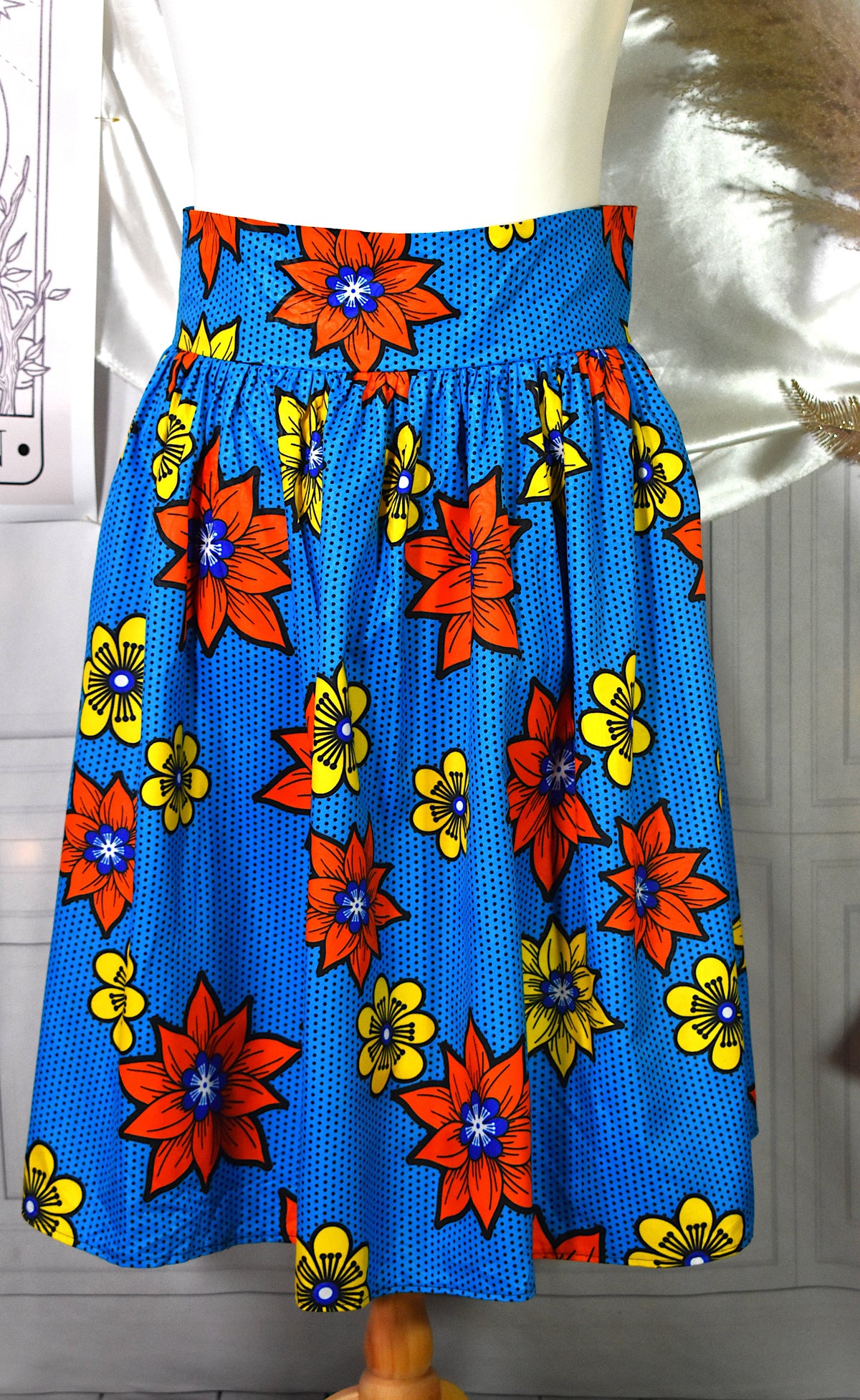 Jupe midi style wax turquoise fleurs jaunes oranges avec sac