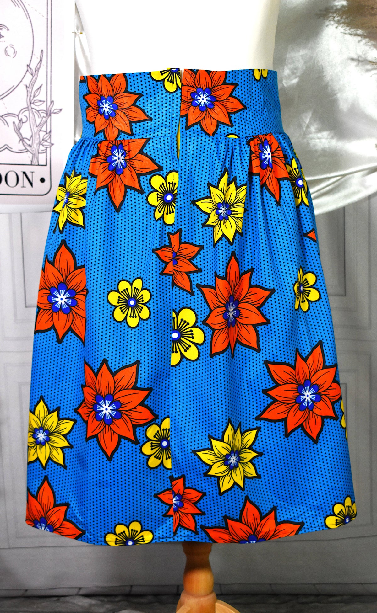 Jupe midi style wax turquoise fleurs jaunes oranges avec sac